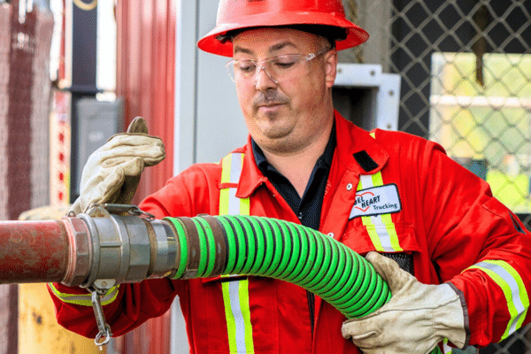 Rebel heart worker installing a water hose
