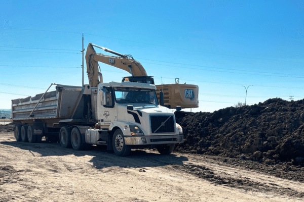 Excavator loading a dump truck