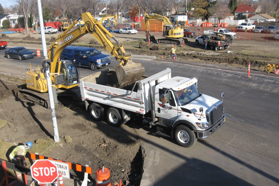 excavator loading a dump truck