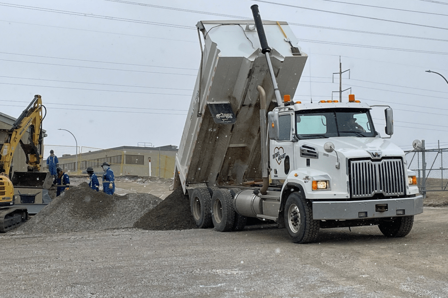 Truck dumping a sand