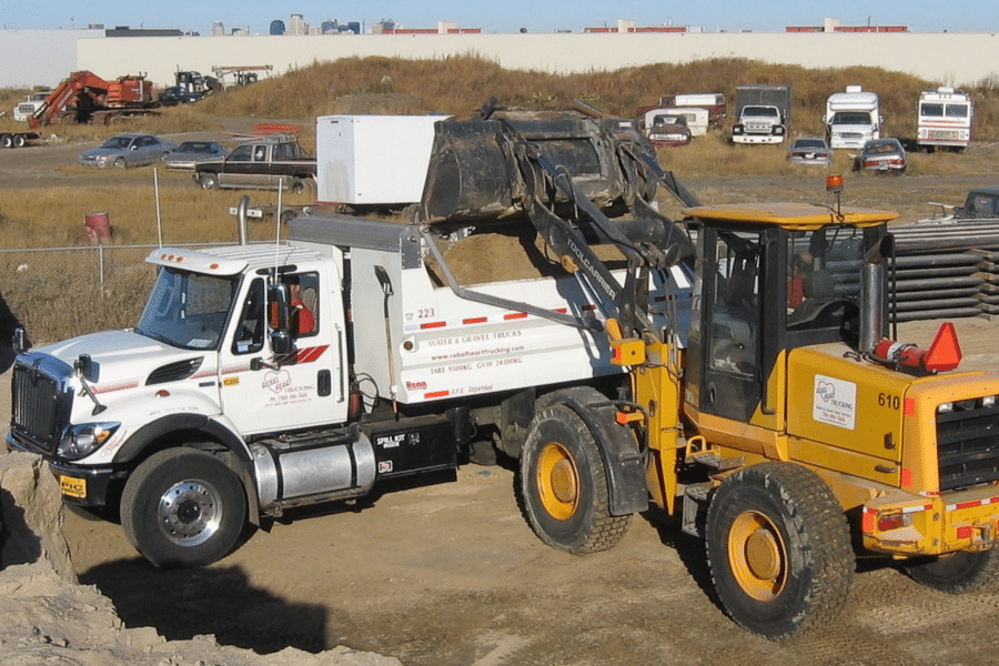 payloader loading a dump truck